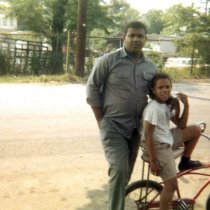 Clyde "Buddy" Williams with boy on bicycle